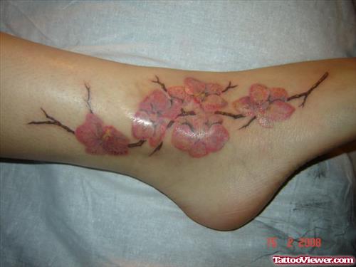 Pink Flowers Tattoos On Girl Foot Tattoo