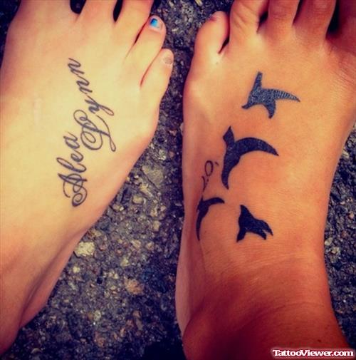 Lettering And Flying Birds Tattoos On Feet