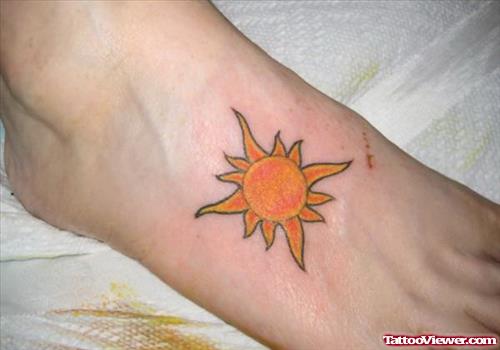 Awesome Tribal Sun Tattoo On Left Foot