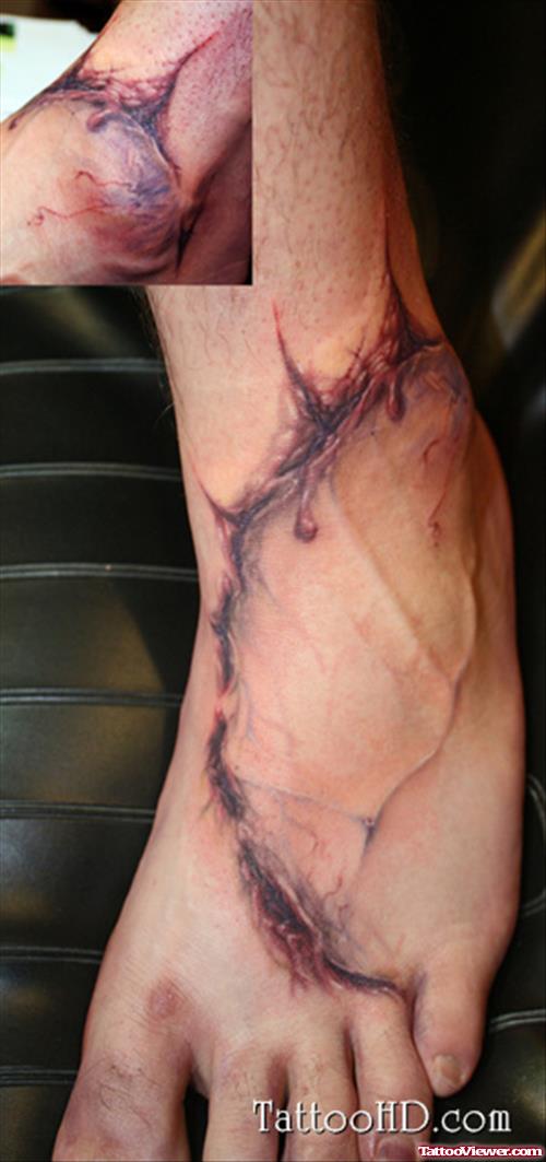 Ripped Skin Foot Tattoo