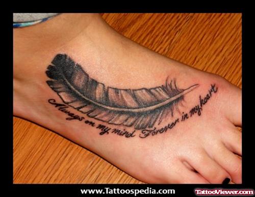Lettering And Feather Foot Tattoo