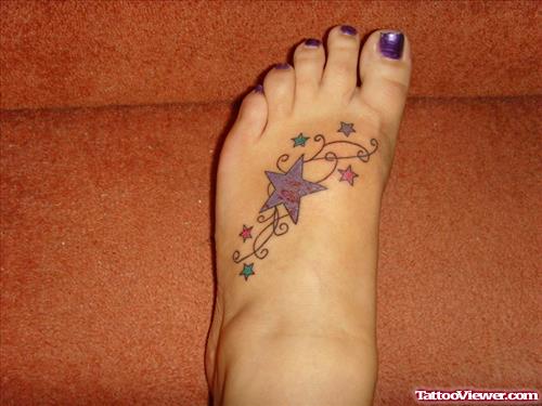 Awesome Colored Stars Foot Tattoo For Young Girls