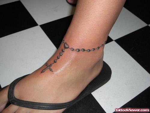 Grey Ink Cross Rosary Foot Tattoo
