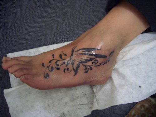 Tribal Butterfly Tattoo On Left Foot