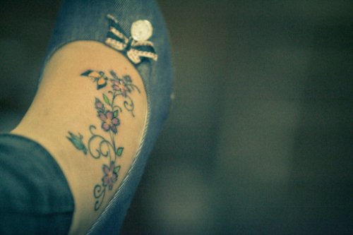 Colored Flowers and Butterflies Foot Tattoo