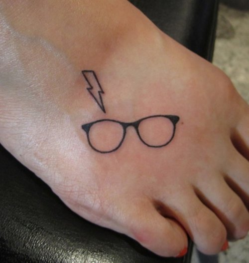 Glasses And Lightning Foot Tattoo