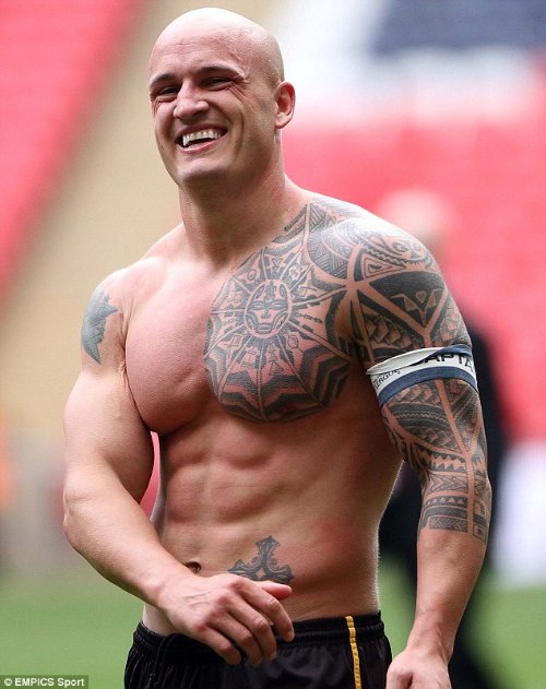 Man Chest And Football Player Tattoo On Left Sleeve