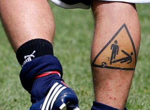 Football Playing isgn Board Tattoo On Back Leg