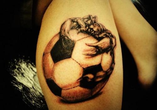 Grey Ink Football Tattoo On Leg