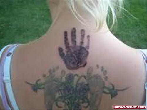 Hand Print Tattoo On Back