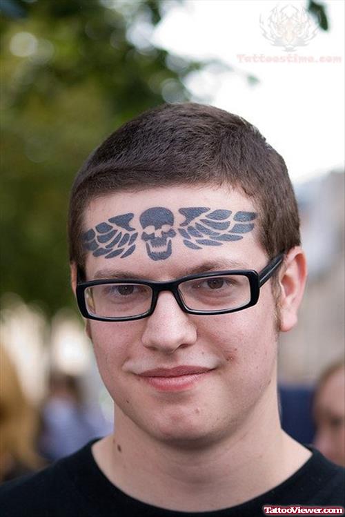 Winged Skull Forehead Tattoo