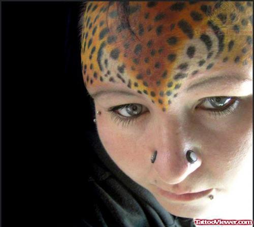 Leopard Skin Tattoo On Forehead