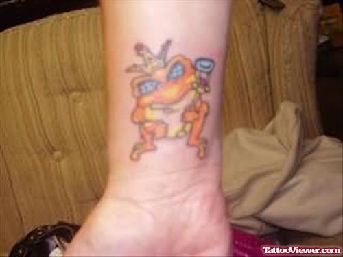 Orange Frog Tattoo On Wrist
