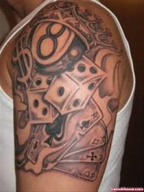 Grey Ink Dice And Eightball Gambling Tattoo On Shoulder