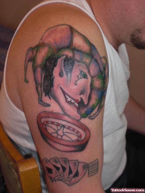 Joker Head And Casino Gambling Tattoo On Right Arm
