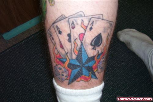 Blue Nautical Star And Cards Gambling Tattoo On Leg