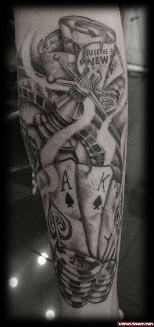 Grey Ink Cards And Poker Gambling Tattoo On Arm