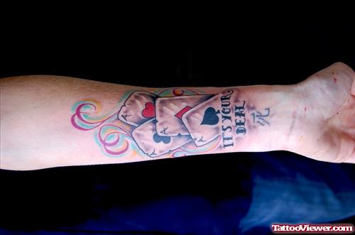 Colored Card Gambling Tattoo On Left Arm