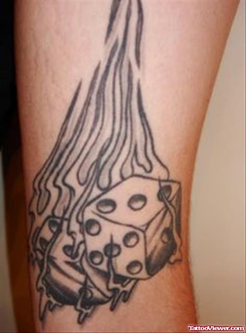 Grey Ink Falming Dice Tattoo On Arm