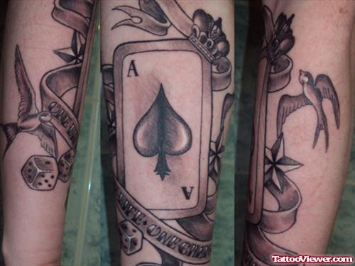 Grey Ink Card Gambling Tattoo On Arm