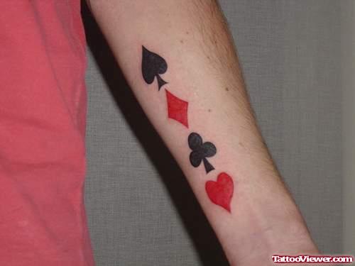 Colored Cards Symbols Gambling Tattoo On Left Forearm