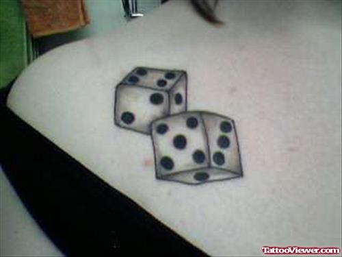 Grey Ink Dice And Gambling Tattoos On Colalrbone