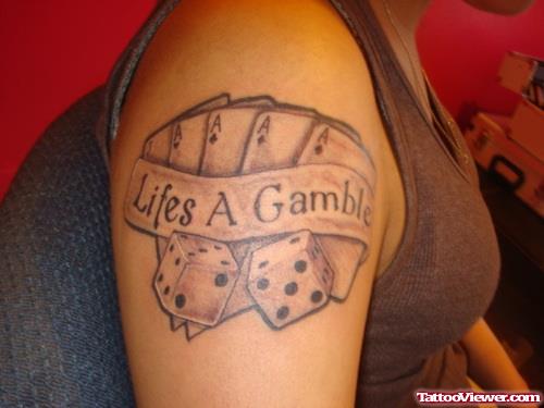 Grey Ink Lifes A Gamble Tattoo On Right Shoulder