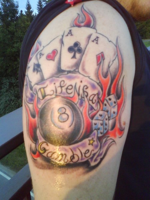 Flaming Cards And Dice Tattoo On Left Half Sleeve