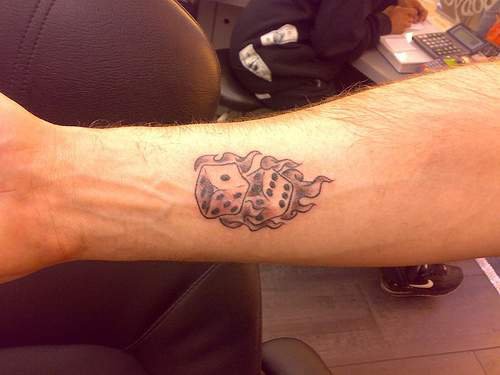 Grey Ink Gambling Dice Tattoo On Right Forearm