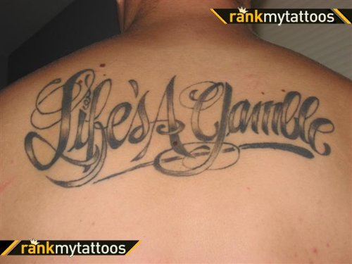 LifeвЂ™s A Gamble Tattoo On Upperback