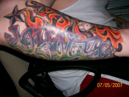 Flaming Gambling Tattoo On Right Arm