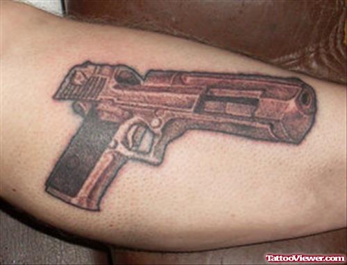 Grey Ink Gangsta Gun Tattoo