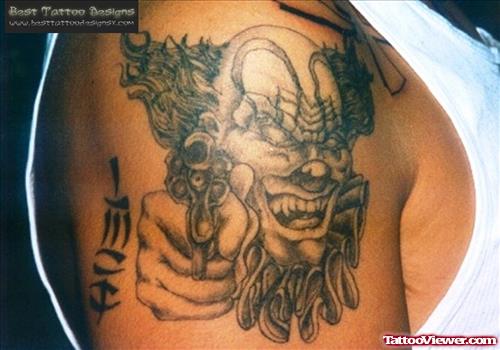 Grey Ink Clon With Gun Gangsta Tattoo On Right Shoulder