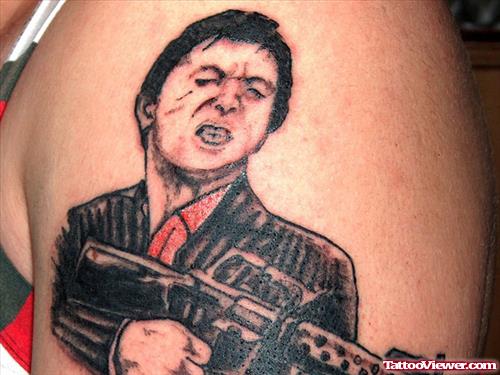 Grey Ink Gangster With Gun Tattoo On Left Shoulder
