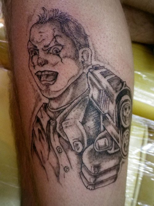 Grey Ink Gangsta Clown Tattoo On Leg
