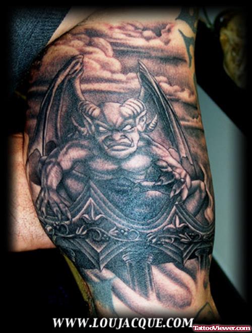 Grey Ink Gargoyle Tattoo On Left Biceop