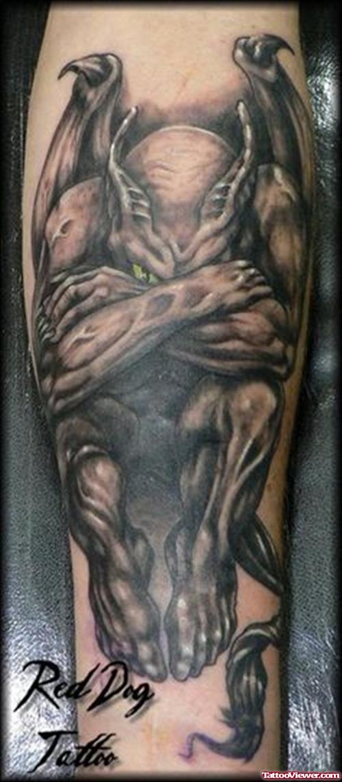 Sad Gargoyle Tattoo On Arm