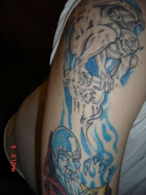 Blue Flames And Gargoyle Tattoo On Half Sleeve