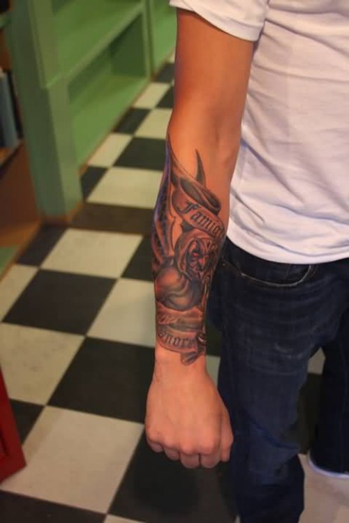 Devil Gargoyle Tattoo With Banner On Forearm