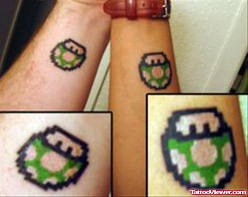 Green Ink Mushroom  Geek Tattoo On Forearm