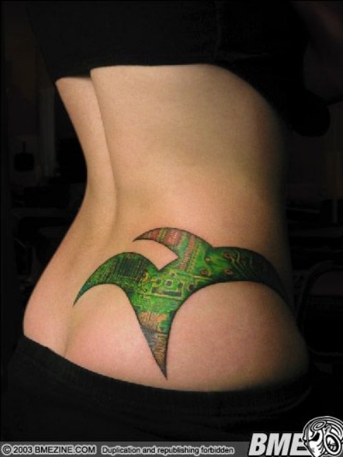 Green Ink Geek Tattoo On Lowerback