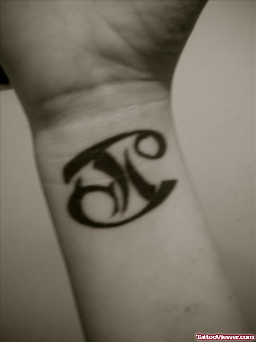 Black Ink Tribal Gemini Zodiac Tattoo On Wrist