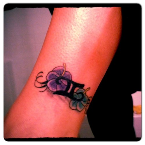 Color Flower And Gemini Tattoo On Arm