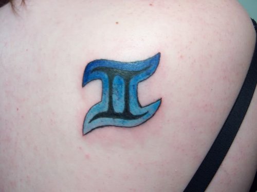 Blue Ink Gemini Tattoo On Back Shoulder