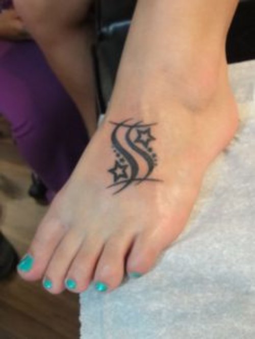 Tribal Gemini Tattoo On Left Foot