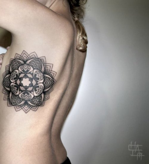 Grey Ink Geometric Flower Tattoo On Rib Side