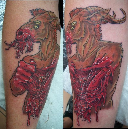 Goat Eating His Flesh Tattoo On Arm