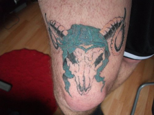Blue Ink Goat Skull Tattoo On Thigh