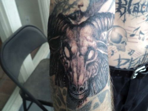 Grey Ink Giger Style Goat Head Tattoo on Half Sleeve