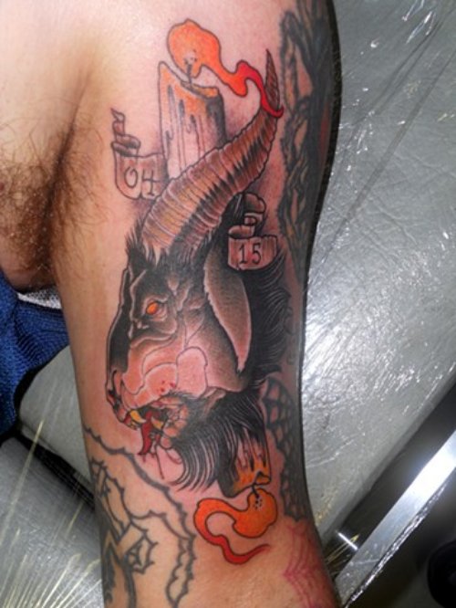 Burning Candle And Goat Head Tattoo On Bicep